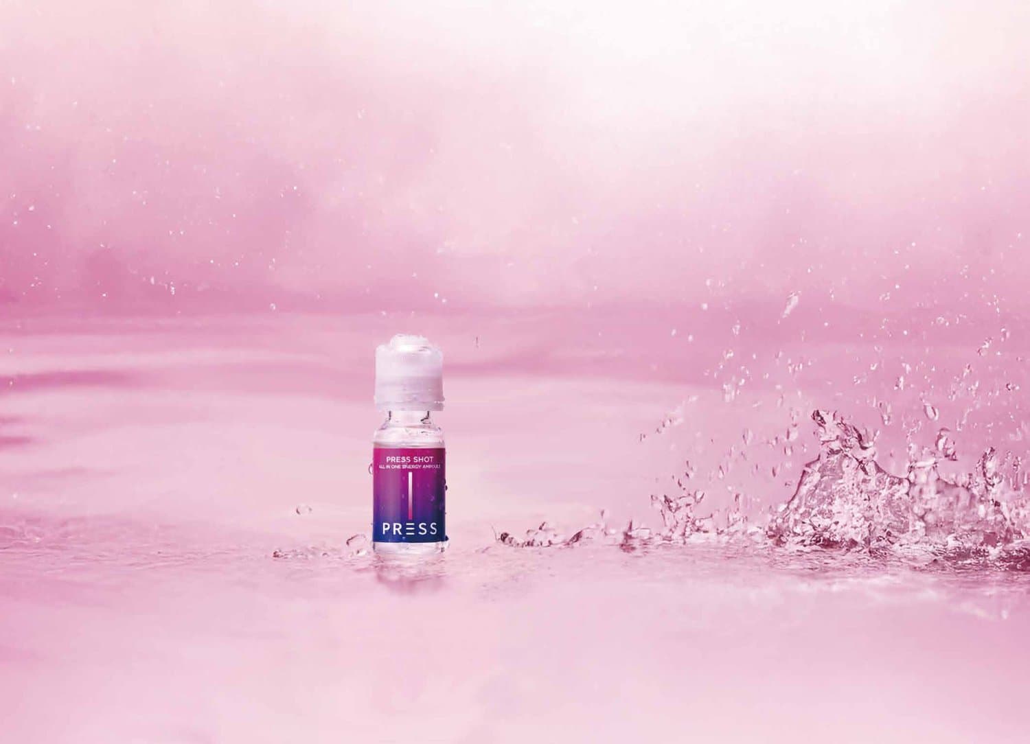 Press Shot bottle in pink liquid